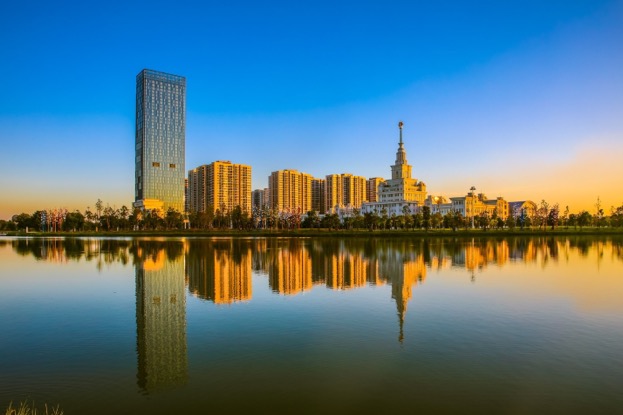 A body of water with a city in the background  Description automatically generated