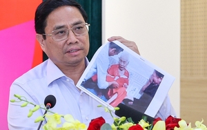 Lễ truy điệu, an táng 76 hài cốt liệt sỹ Việt Nam hy sinh tại Lào - Ảnh 4.