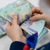 Bỏ cấp huyện, lương tối thiểu vùng thay đổi thế nào từ 1/7?